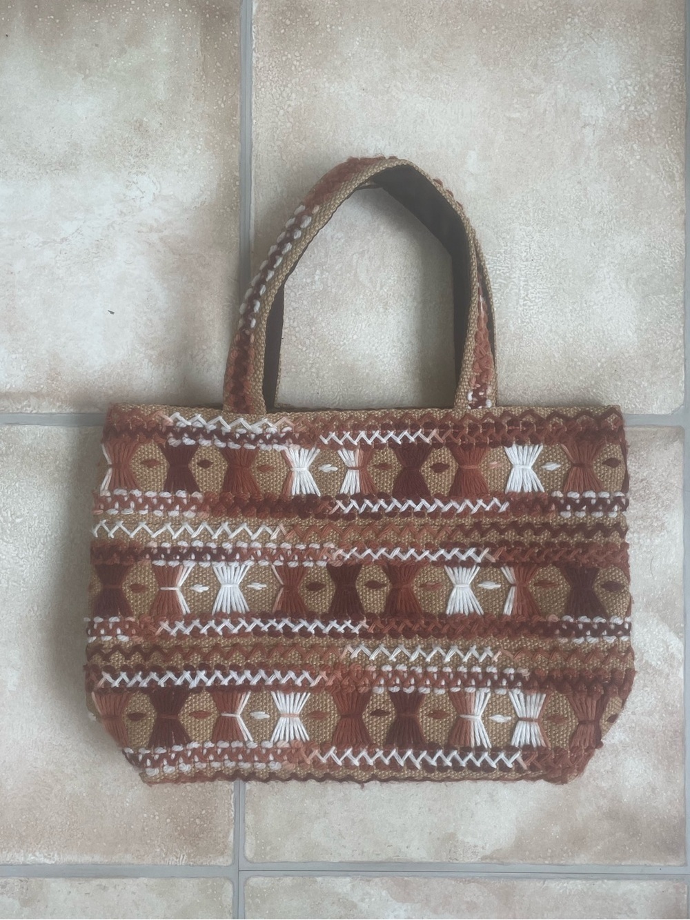 Handmade brown tan white woven tote bag, interior pocket, snap enclosure